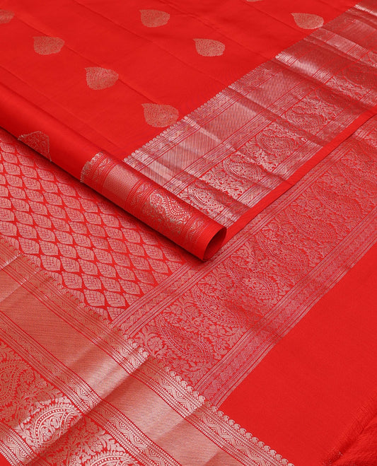 Red zari buttas silksaree, zari border of manga mokku,muthu,puli nagam, floral & manga design & zari elevated pallu of leaf motifs