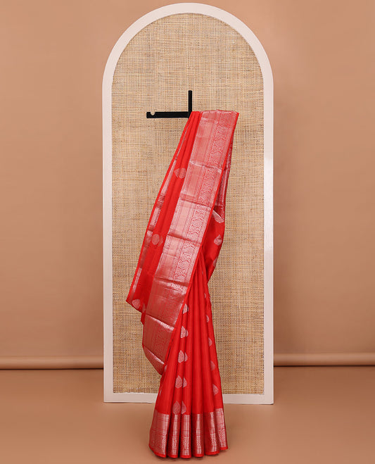 Red zari buttas silksaree, zari border of manga mokku,muthu,puli nagam, floral & manga design & zari elevated pallu of leaf motifs