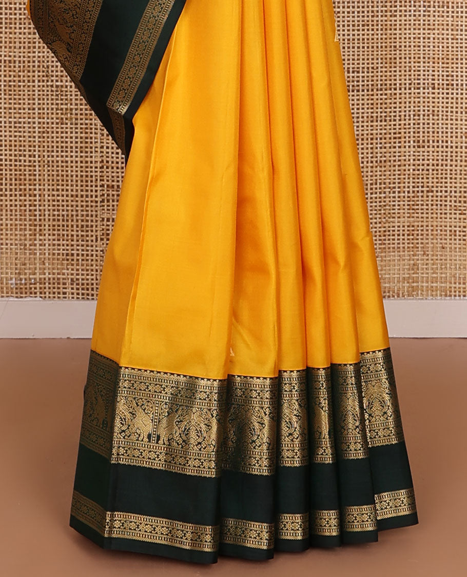 Yellow zari buttas silk saree, contrast rettai pettu border of salngai,banaras,muthu,kili & yaanai designs & jaal pallu