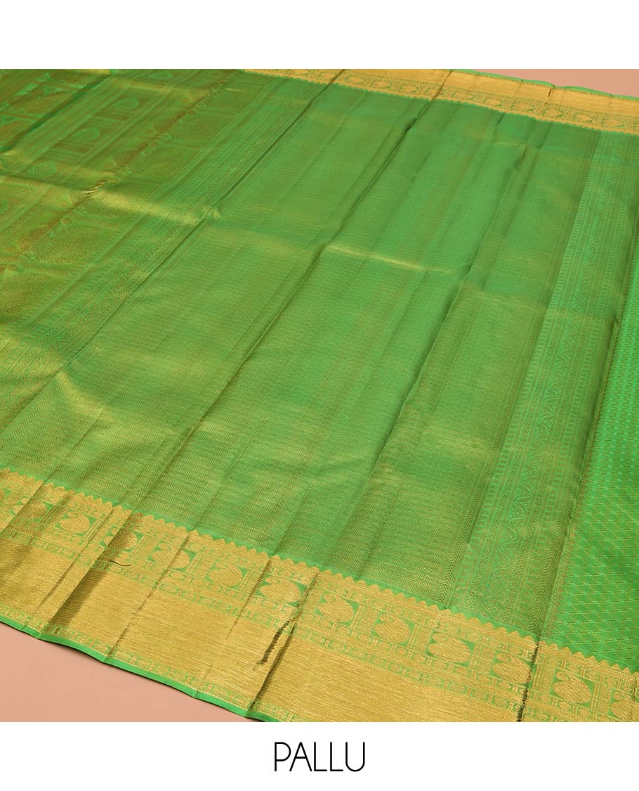 Green Kanchipuram Wedding Silk Saree, Entralled with Jacquard Design On Its Body, Highlighted by Zari Border of Rekku, Kathir, Muthu, Manga and Zari Stripes, Grand Pallu and Paired with a Matching Blouse