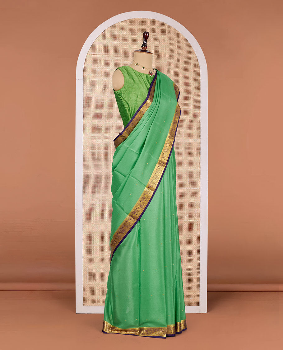 Green Mysore Silk Saree, Gleamed Up with Zari Buttas All Over Its Body, Complemented by a Contrast Traditional Zari Design Border, Zari-Buttas Woven Pallu, and Paired with a Contrast Blouse