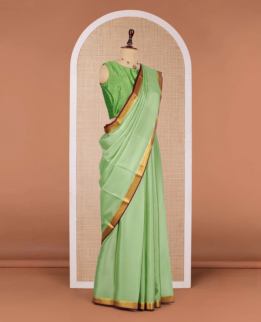 Green Plain Mysore Silk Saree, Complemented by a Contrast Traditional Zari Design Border, Zari-Striped Pallu, and Paired with a Contrast Blouse
