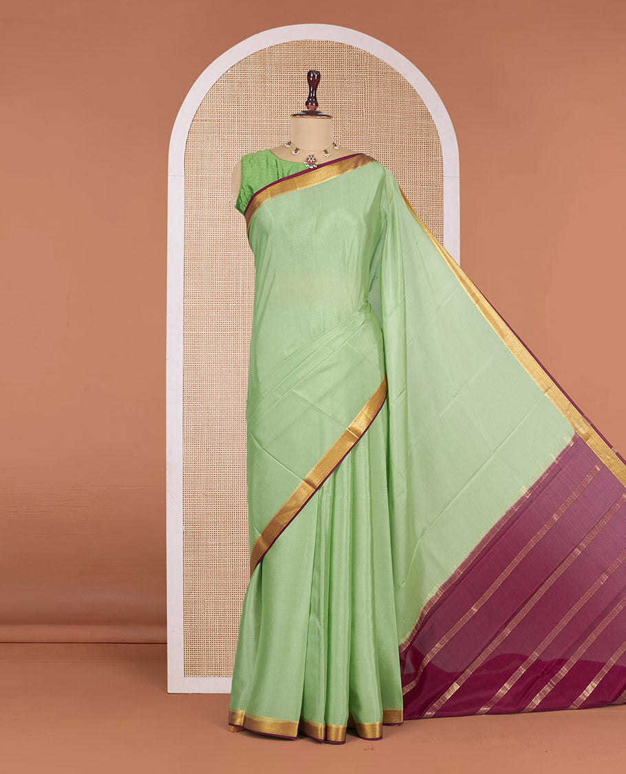 Green Plain Mysore Silk Saree, Complemented by a Contrast Traditional Zari Design Border, Zari-Striped Pallu, and Paired with a Contrast Blouse