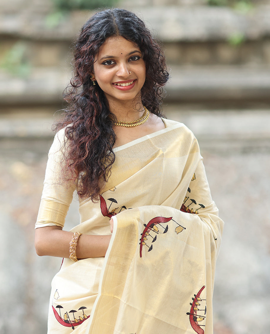 Gold Kerala Tissue Saree, Artfully Detailed with Vallam Kali Motifs, Gold Zari Border, a Self-Pallu, a Matching Blouse