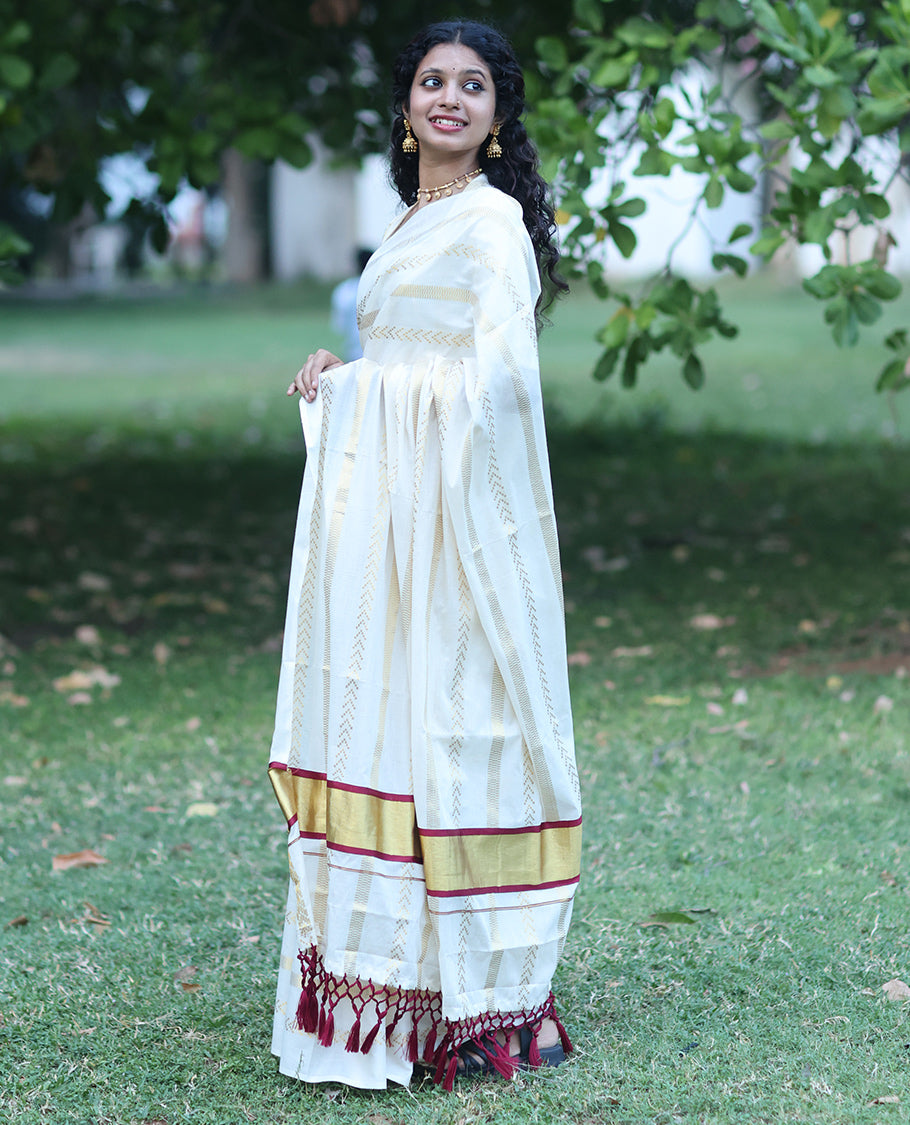 Borderless Cream Kerala Tissue Saree, Richly Detailed with Geometric Zari Stripes, and a Matching Blouse