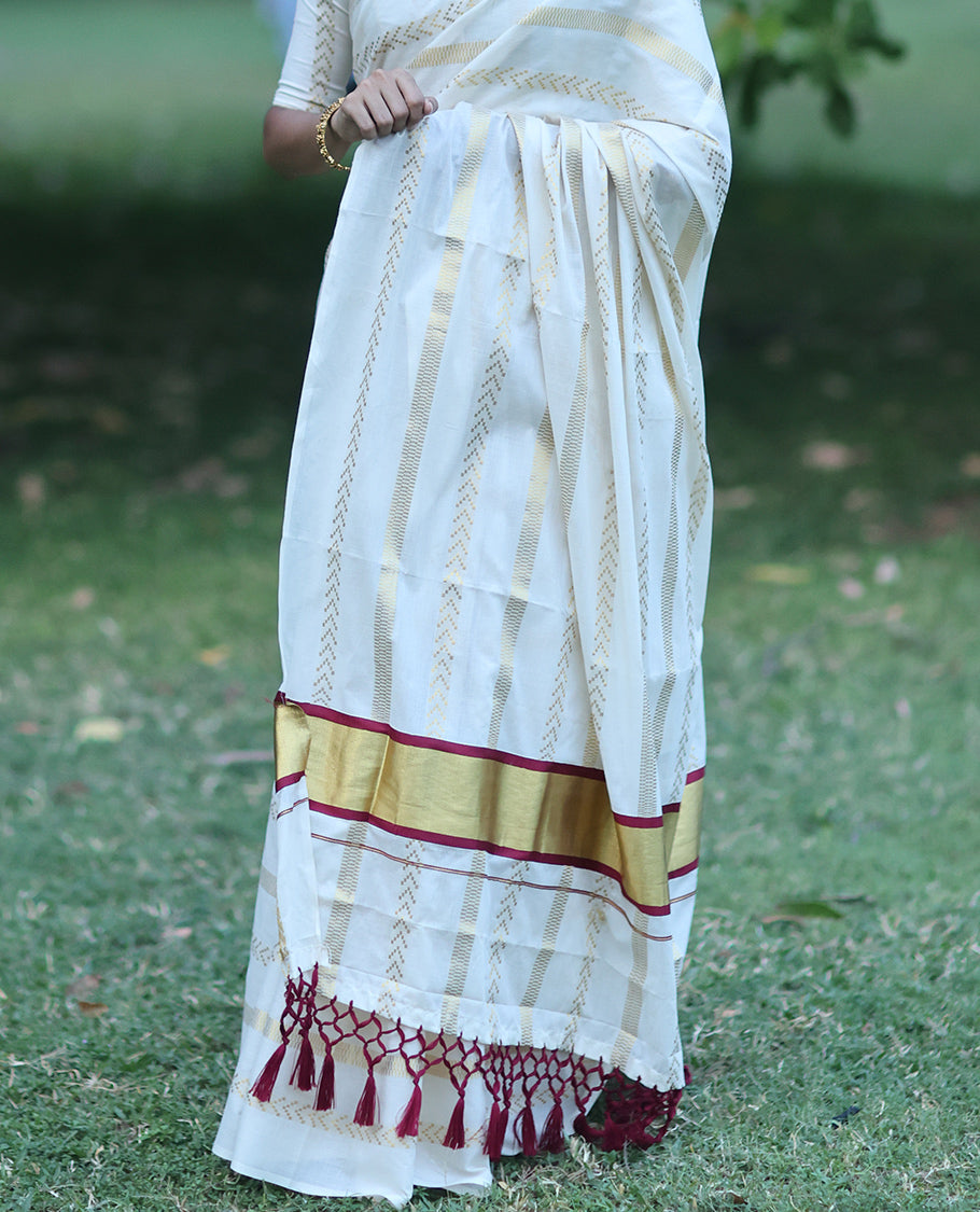 Borderless Cream Kerala Tissue Saree, Richly Detailed with Geometric Zari Stripes, and a Matching Blouse