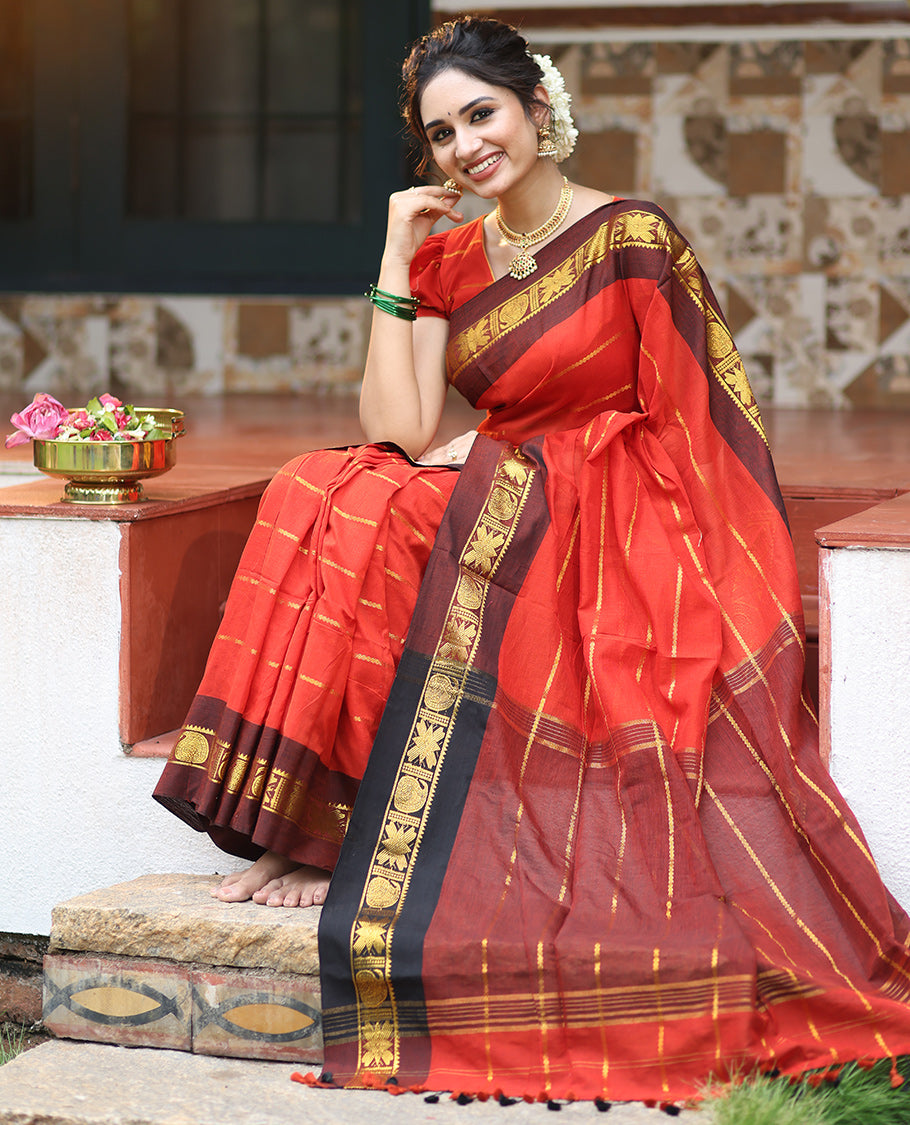 Rust Khadi Mul Cotton Saree, Adorned with Veldhari Stripes, Complemented by a Contrast Traditional Zari Border, Striped Pallu, and No Blouse