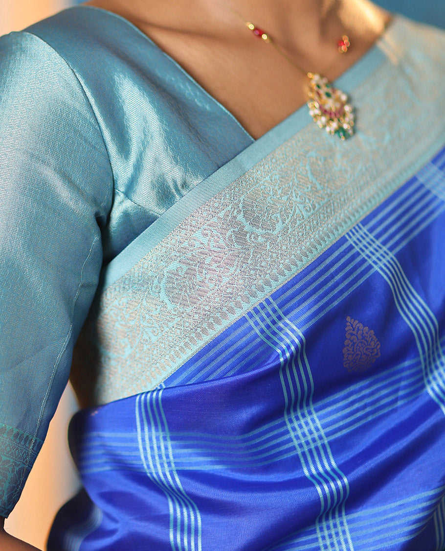 Blue Art Kanchi Silk Saree Features Butta Enclosed Checks, a Contrast Temple Rettai Pettu Border, Grand Pallu, and a Contrast Blouse