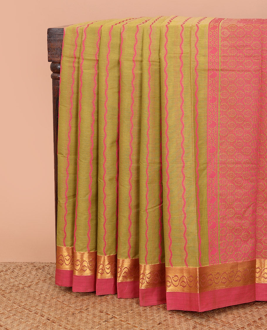 Green zig-zag striped kanchi cotton saree, contrast leaf creeper zari border, and jaal pallu