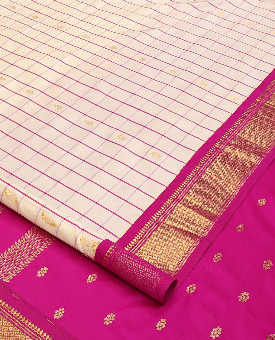 Cream kamalam zari buttas with checked Kanchipuram silk saree, contrast korvai border of thilakam mokku, banaras, and mayil kann designs, and zari design pallu