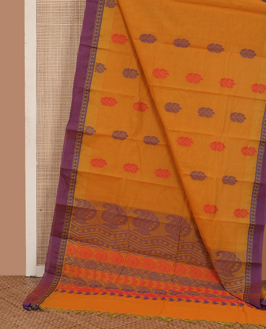 Mustard buttas kanchi cotton saree, contrast traditional motifs border, and pallu of paisley designs