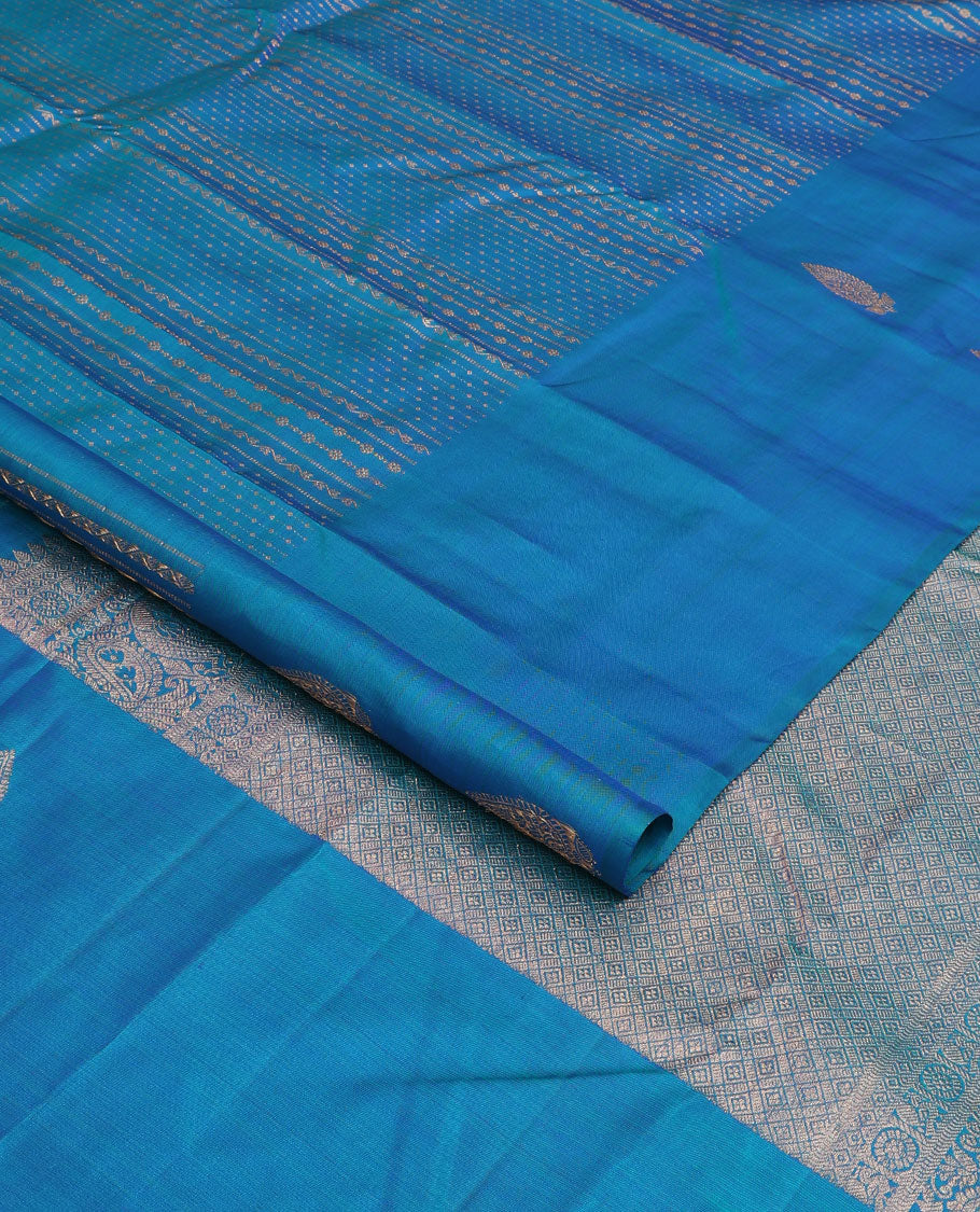 Blue zari design Kanchipuram silk saree, zari border, and pallu of thazampoo rekku, mayil chakram, and jaal design
