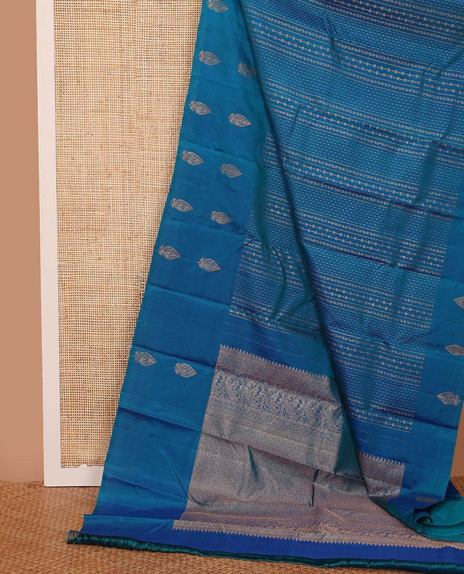 Blue zari design Kanchipuram silk saree, zari border, and pallu of thazampoo rekku, mayil chakram, and jaal design