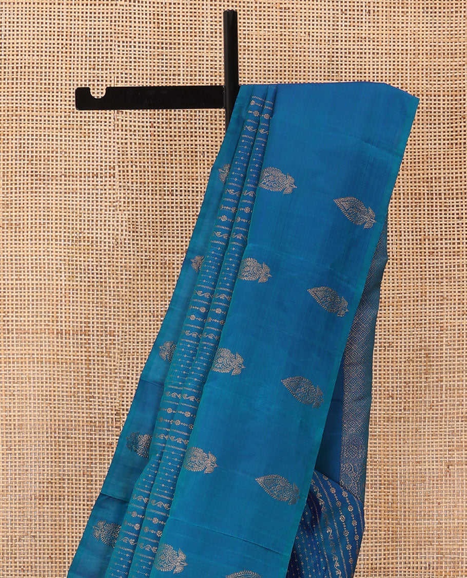 Blue zari design Kanchipuram silk saree, zari border, and pallu of thazampoo rekku, mayil chakram, and jaal design