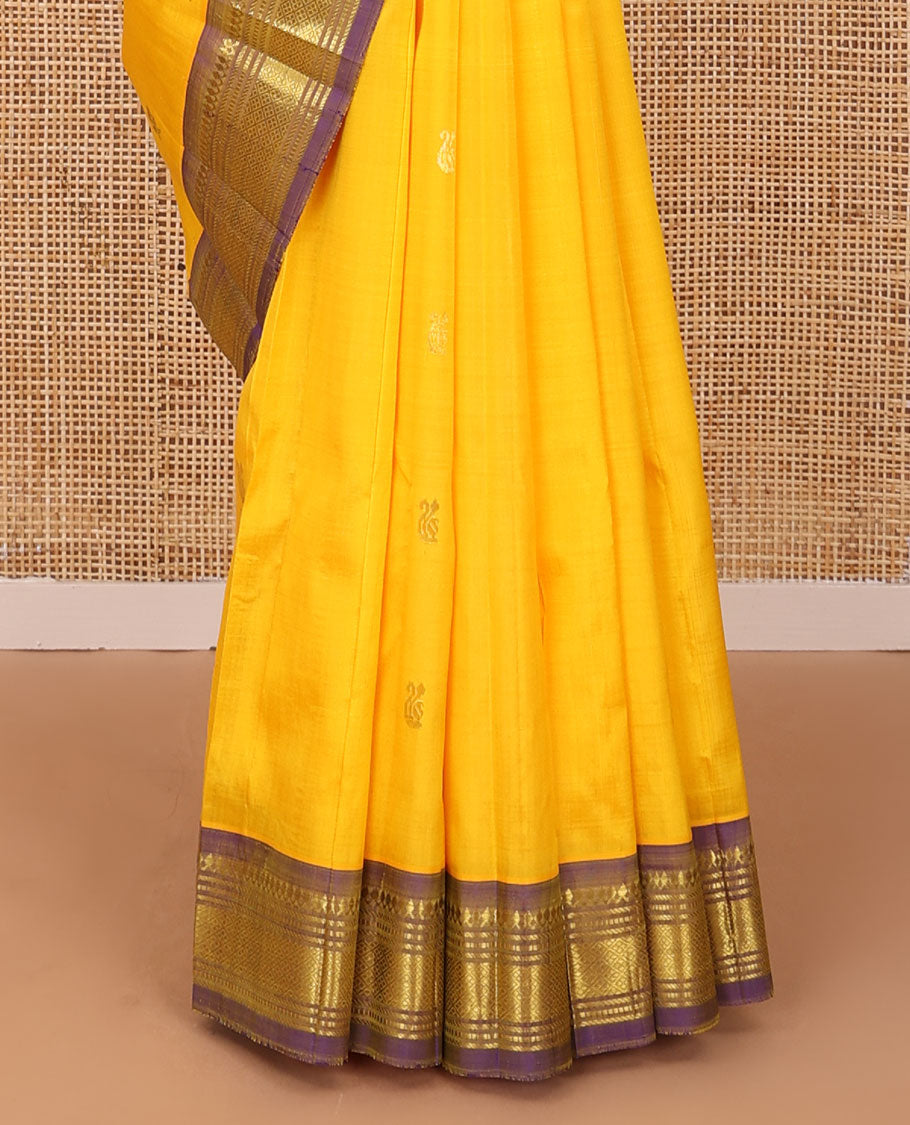 Yellow zari buttas Kanchipuram silk saree, contrast one-sided border of thilakam mokku,banaras,muthu & jaal, & zari design pallu