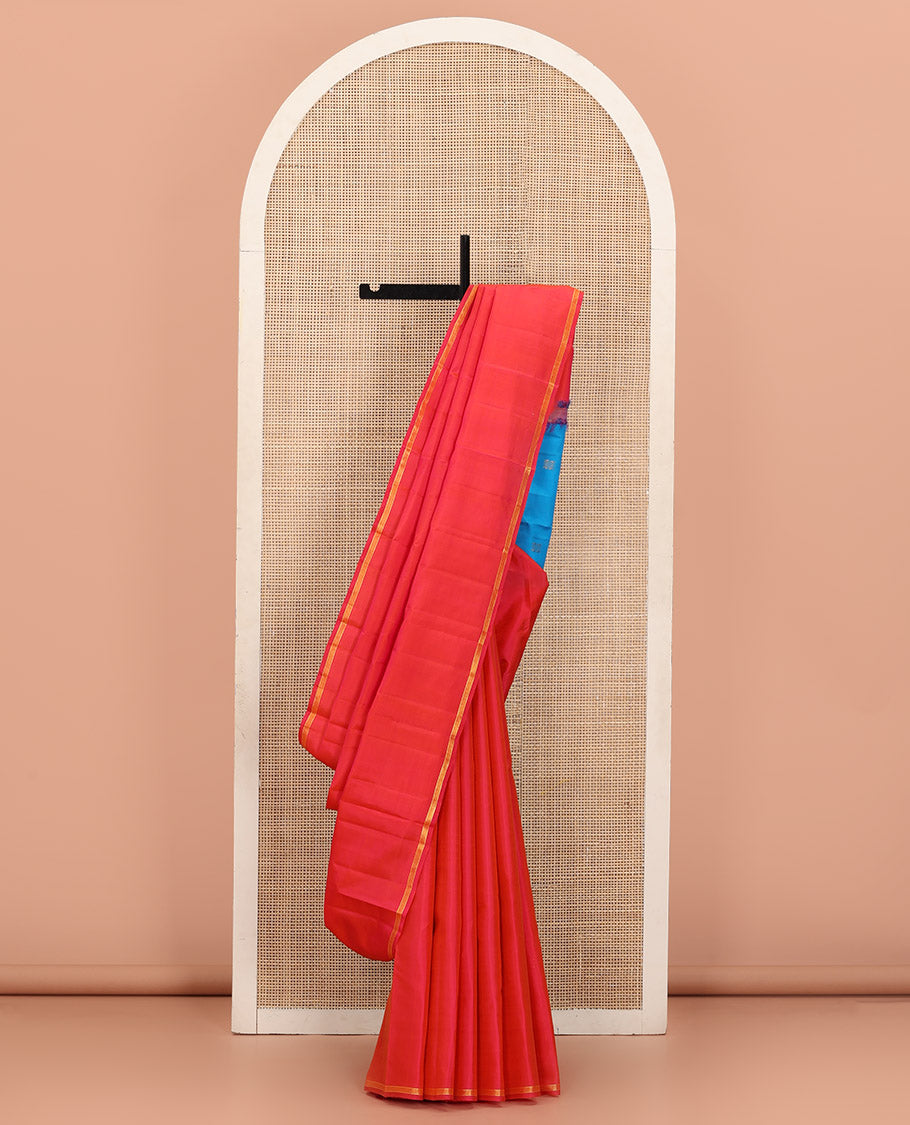 Captivating Pink Plain Kanchipuram Silk Saree, Subtly Woven Zari Striped Border, Complemented by Vibrantly Colored Pallu of Zari Buttas, and Paired with a Contrast Blouse