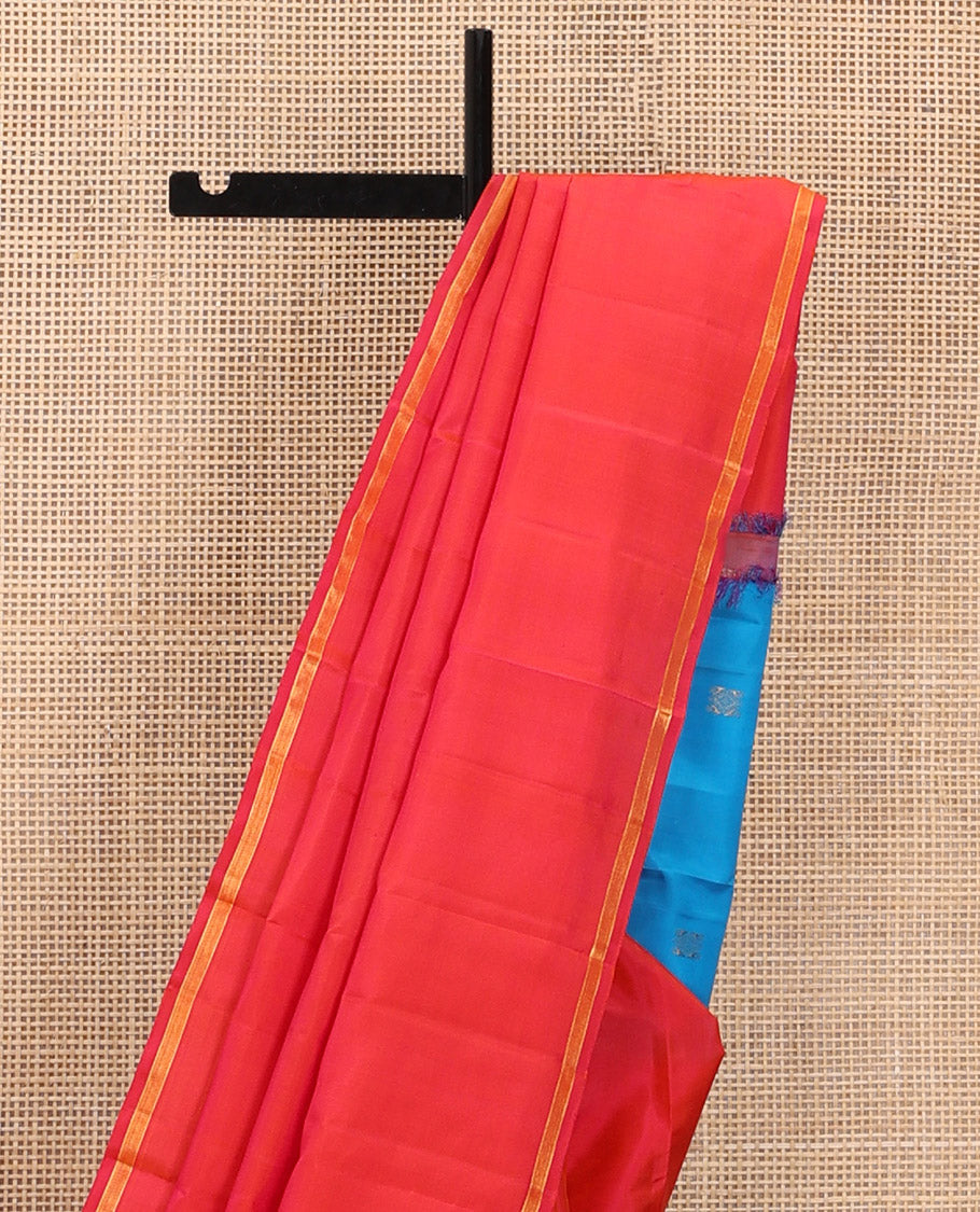 Captivating Pink Plain Kanchipuram Silk Saree, Subtly Woven Zari Striped Border, Complemented by Vibrantly Colored Pallu of Zari Buttas, and Paired with a Contrast Blouse