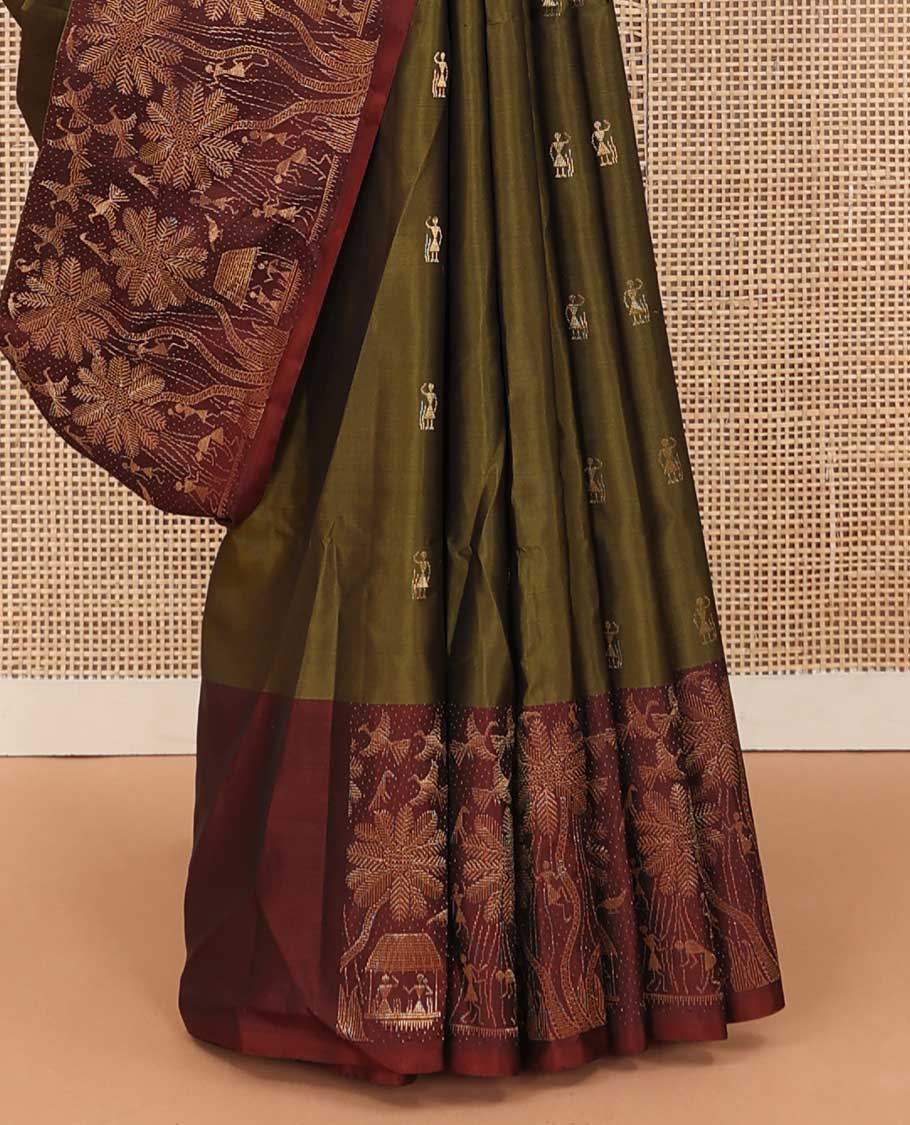 Green warli motifs woven soft silk saree, contrast warli-village theme woven border, and pallu of floral and warli-village theme designs