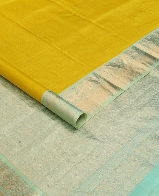 Mustard zari design silk saree, contrast border of thilakam, kathir, and mayil designs, and then kuli kann style oven pallu