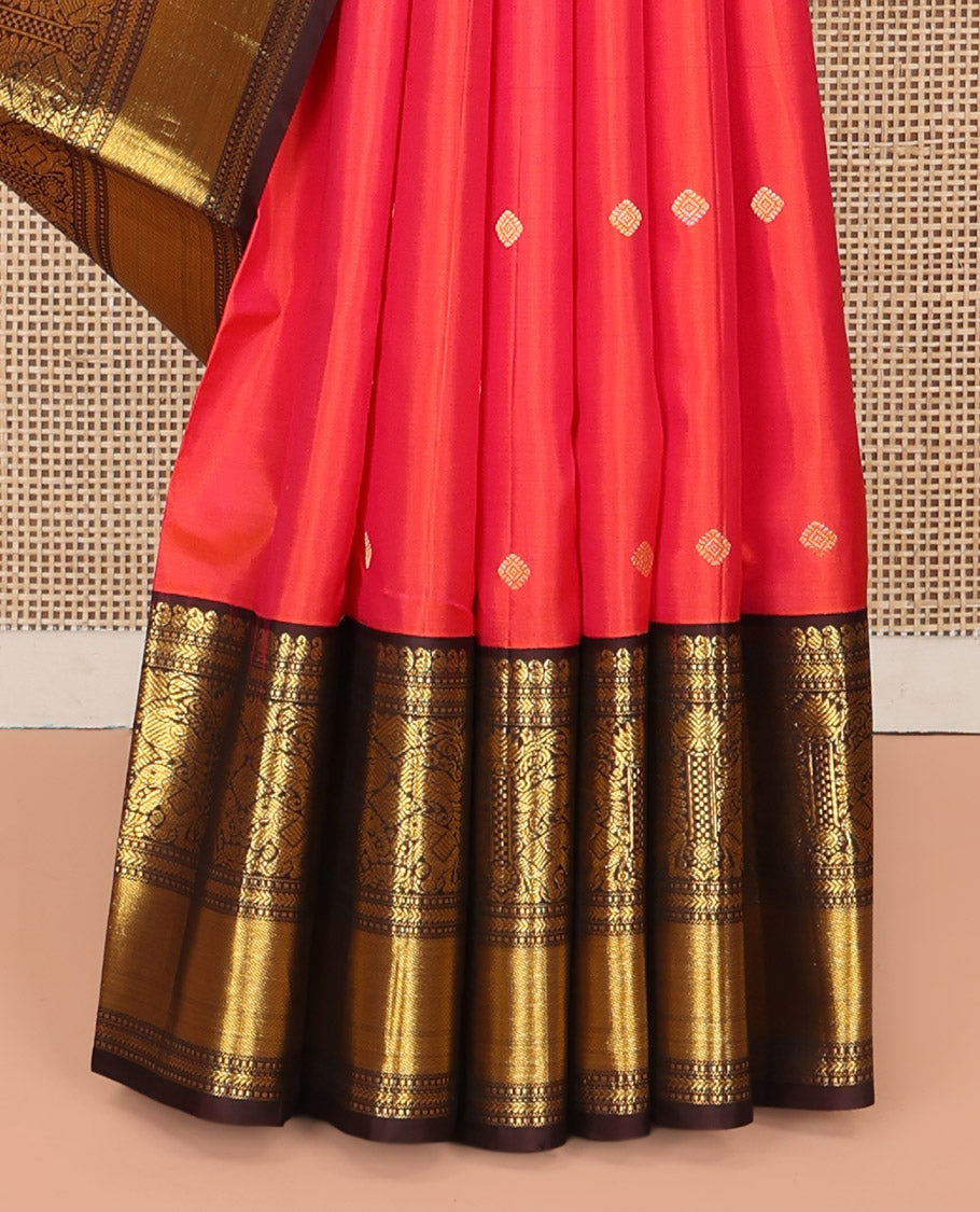 Coral Vasundhara Silk Saree, Elevated with Zari Buttas All Over Its Body, Complemented by a Contrast Border of Manga, Muthu, Kathir, Mayil, and Yaanai Designs, Grand Jaal Pallu, and Paired with a Contrast Blouse