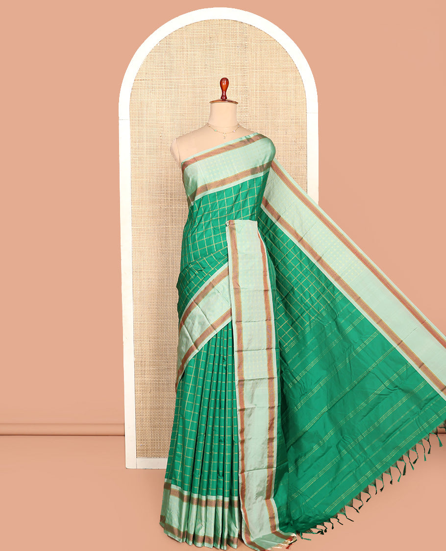 Green Aarani Silk Saree, Spotlighted with Zari Medium-Sized Checked All Over Its Body, Complemented by a Contrast Zari Buttas Woven Border, Pallu of Stripes, and Paired with a Matching Blouse