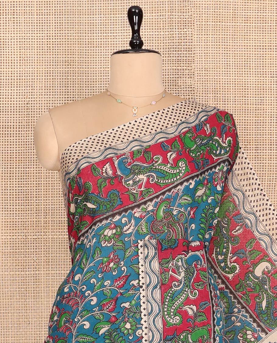 Blue Machine-Printed Kalamkari Cotton Saree Features Floral and Peacock, a Contrast Peacock Border, Kalamkari Printed Pallu, and a Contrast Blouse