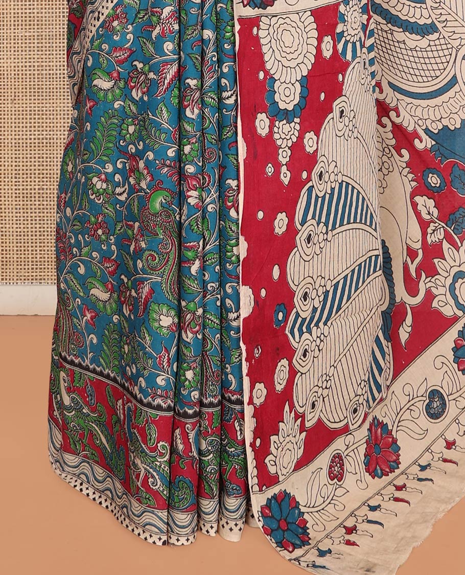 Blue Machine-Printed Kalamkari Cotton Saree Features Floral and Peacock, a Contrast Peacock Border, Kalamkari Printed Pallu, and a Contrast Blouse