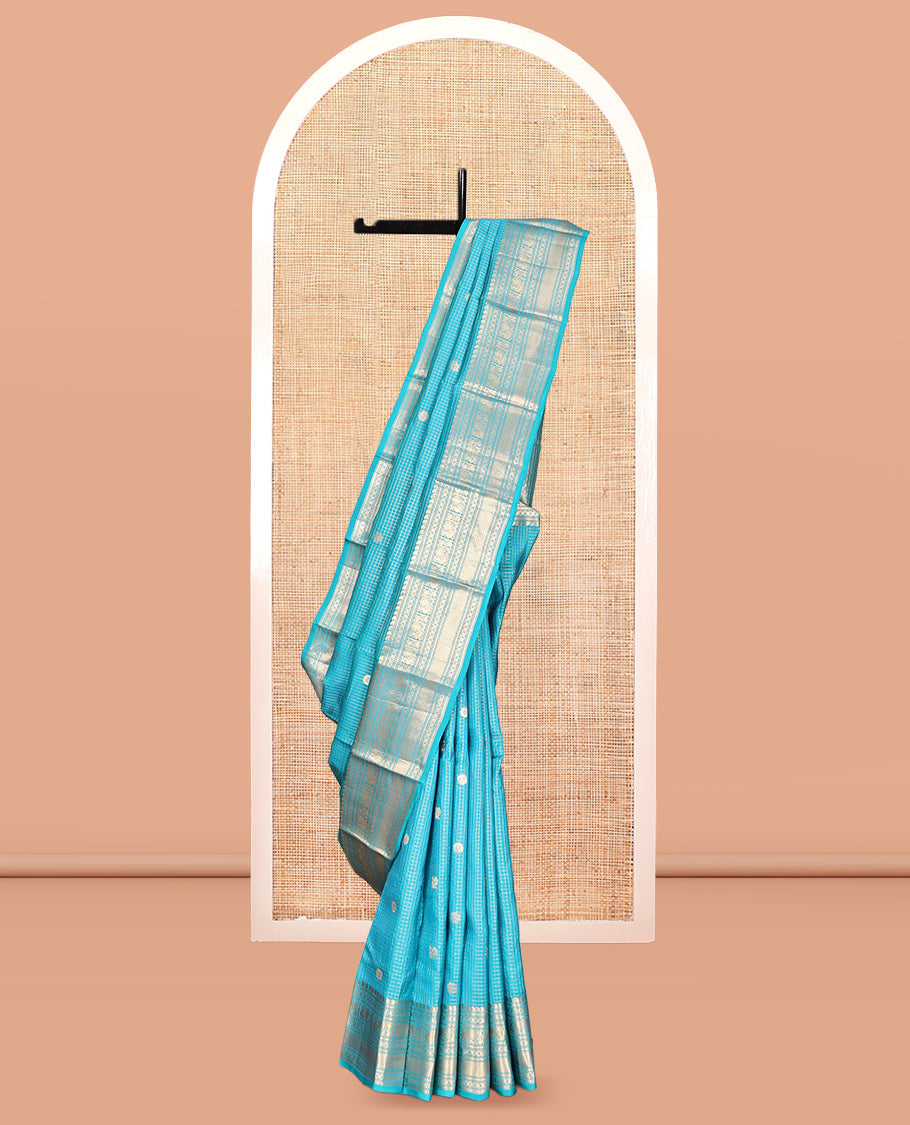 Blue Vasundhara Lite Silk Mix Saree, Richly Detailed with Zari Buttas and Zari Checks All Over Its Body, Highlighted by a Zari Border of Manga, Neli, Kamalam, Mayil, and Vanki Designs, Gleaming Intricately Designed Pallu, and Paired with a Matching Blouse
