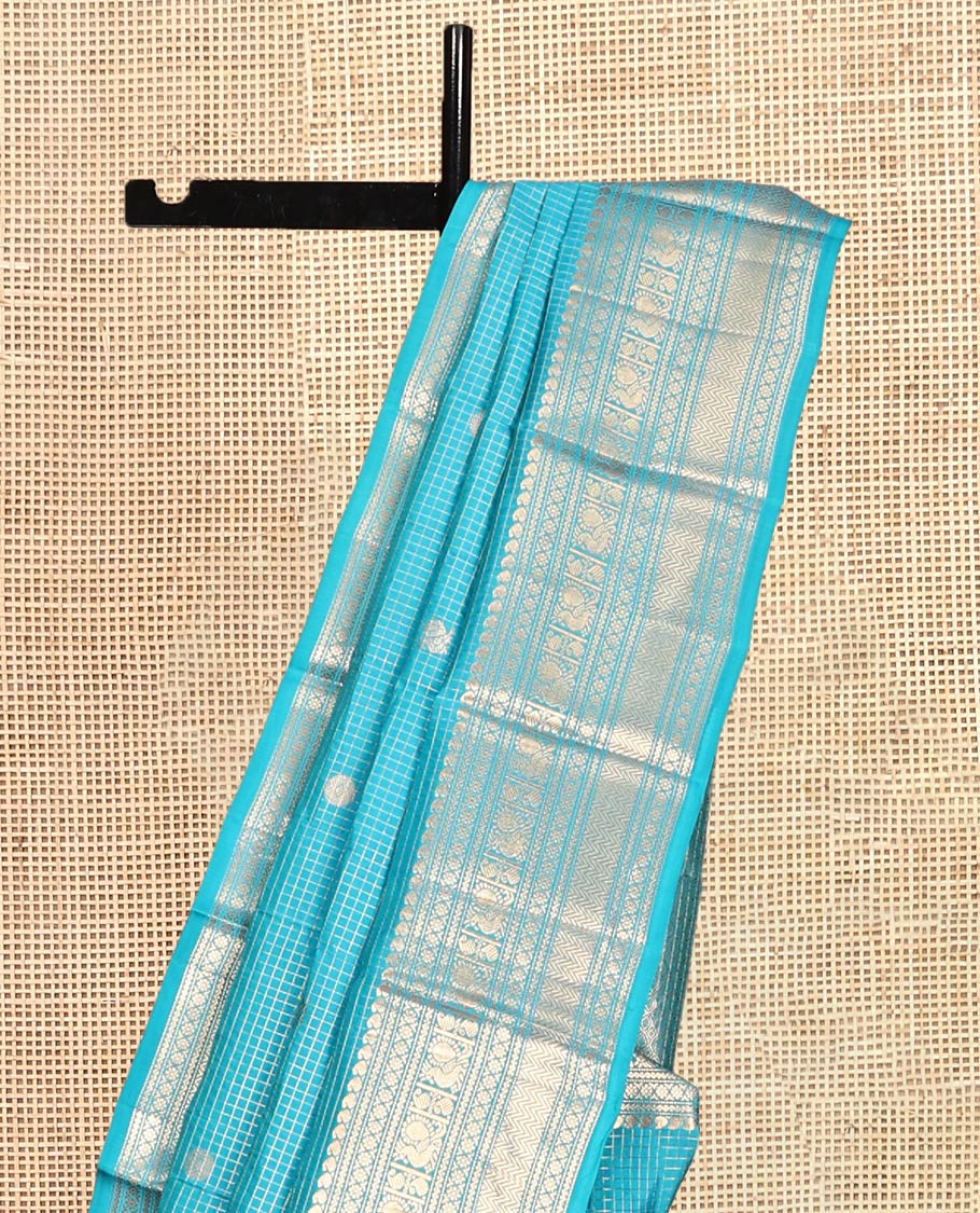 Blue Vasundhara Lite Silk Mix Saree, Richly Detailed with Zari Buttas and Zari Checks All Over Its Body, Highlighted by a Zari Border of Manga, Neli, Kamalam, Mayil, and Vanki Designs, Gleaming Intricately Designed Pallu, and Paired with a Matching Blouse