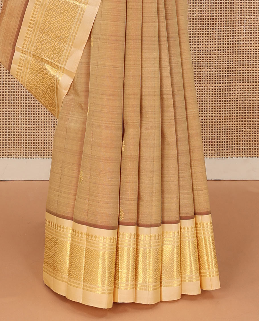 Sandal zari buttas Kanchipuram silk saree, contrast one-sided border of panner sombu, banaras, and mayil kann, and zari woven pallu