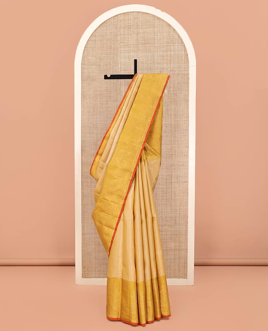 Sandal Kanchipuram Designer Silk Saree, Gracefully Embellished with Buttas All Over Its Body, Complemented by a Contrast Border of Mayil, Kuthirai, Yaali, and Pichwai Cow Designs, Grandly Woven Jaal Pallu, and Paired with a Contrast Blouse