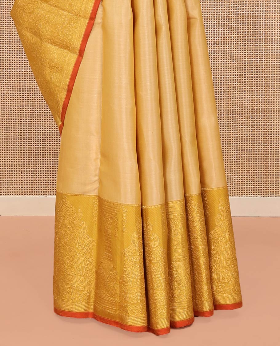 Sandal Kanchipuram Designer Silk Saree, Gracefully Embellished with Buttas All Over Its Body, Complemented by a Contrast Border of Mayil, Kuthirai, Yaali, and Pichwai Cow Designs, Grandly Woven Jaal Pallu, and Paired with a Contrast Blouse