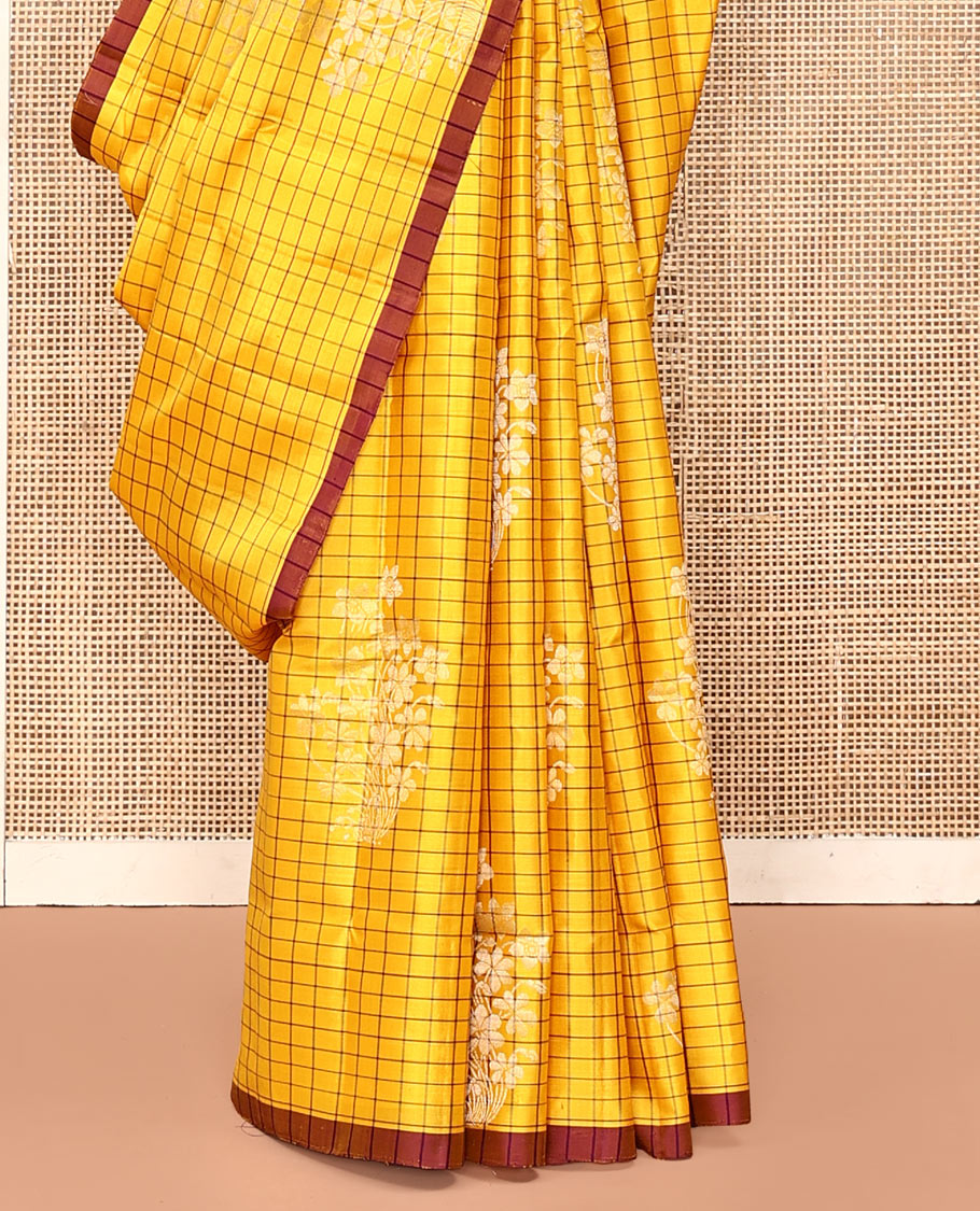 Yellow Mayuri Soft Silk Saree, Richly Detailed with Checks and Buttas All Over Its Body, Subtle Contrast Piping Border, Majestically Detailed Pallu of Leaf Designs, and Paired with a Contrast Blouse