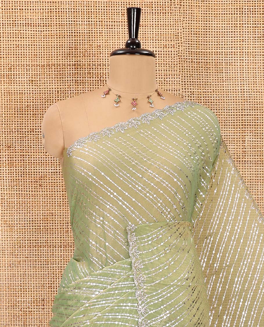Green diagonal striped foli printed shimmer chiffon saree, scallop jarkan stone work border, self-pallu, and plain blouse