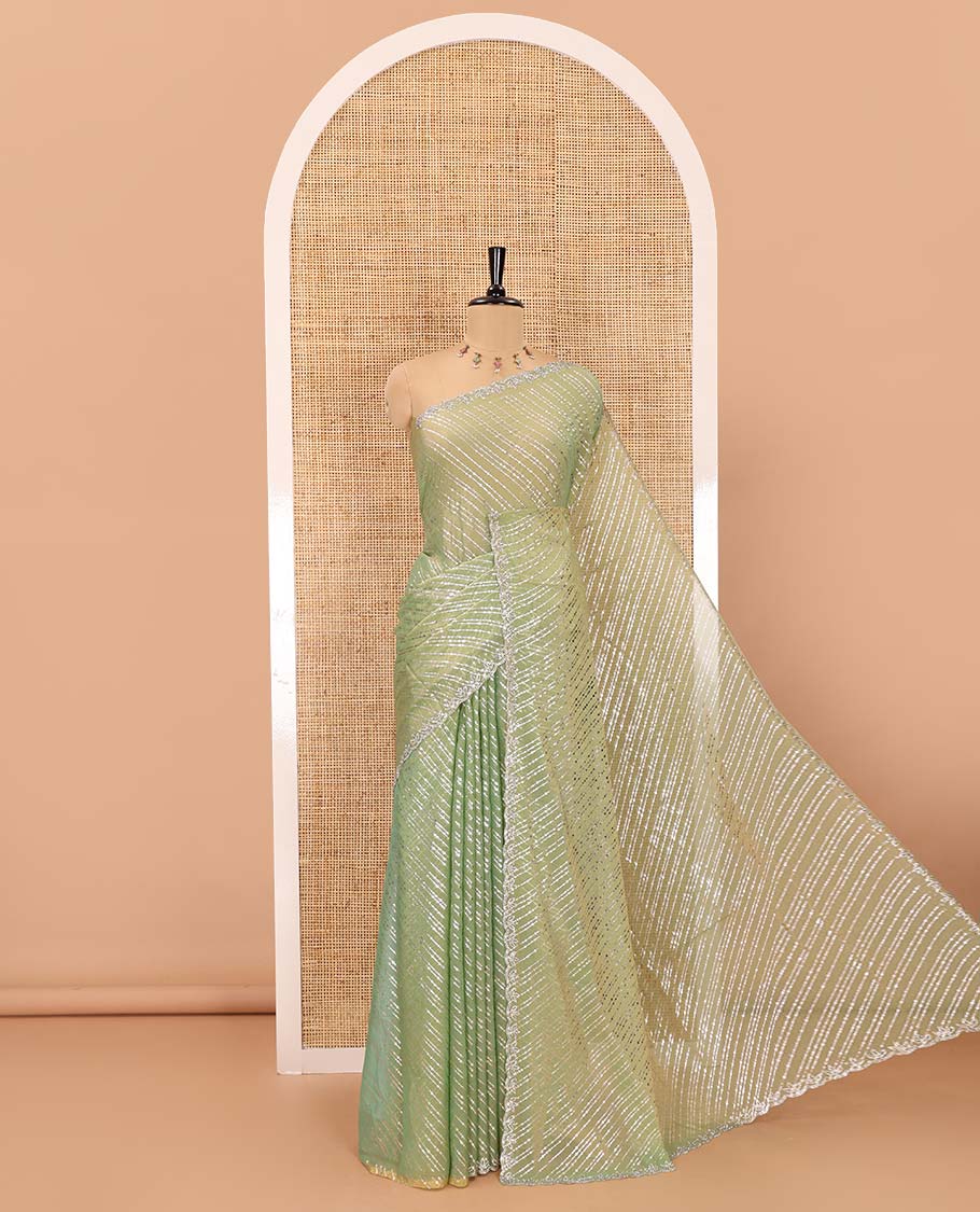 Green diagonal striped foli printed shimmer chiffon saree, scallop jarkan stone work border, self-pallu, and plain blouse