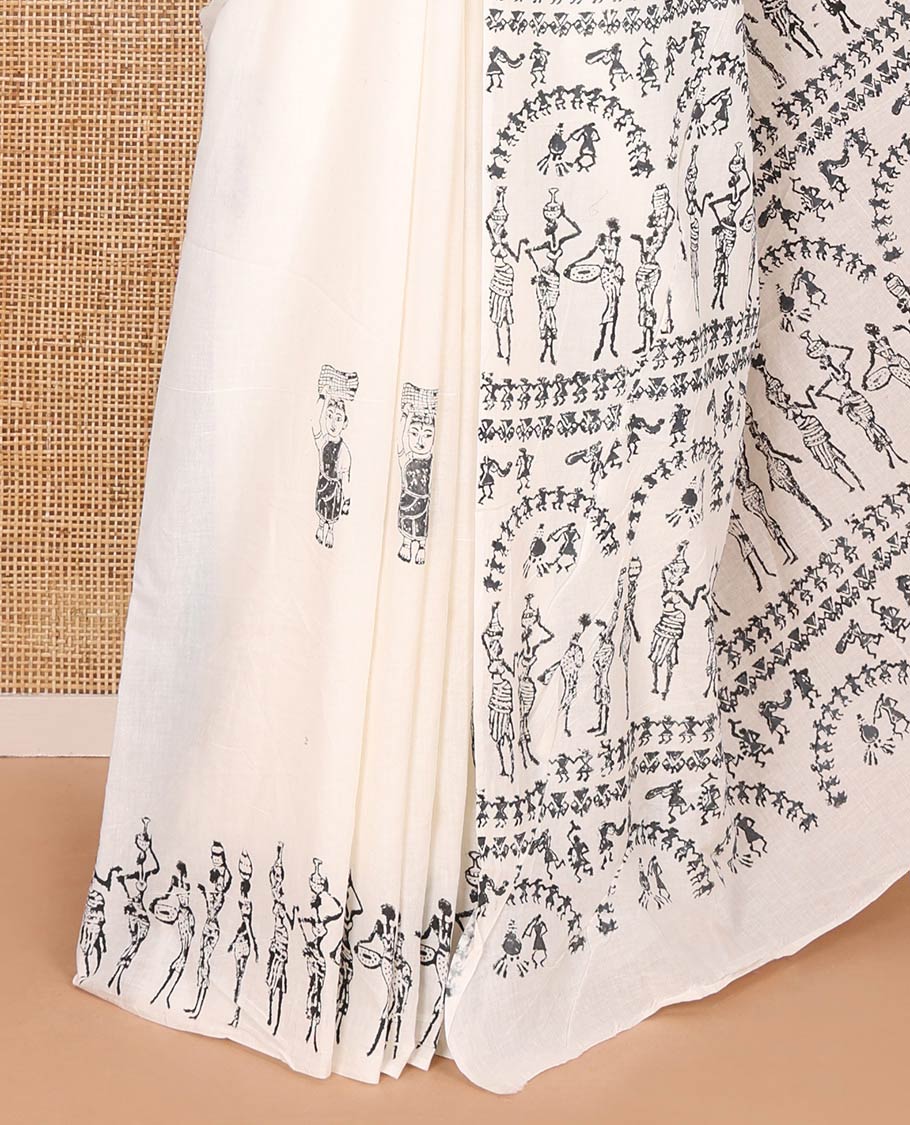 Cream warli-style human motifs block printed mul cotton saree, warli block printed border, warli block printed pallu, and a matching blouse