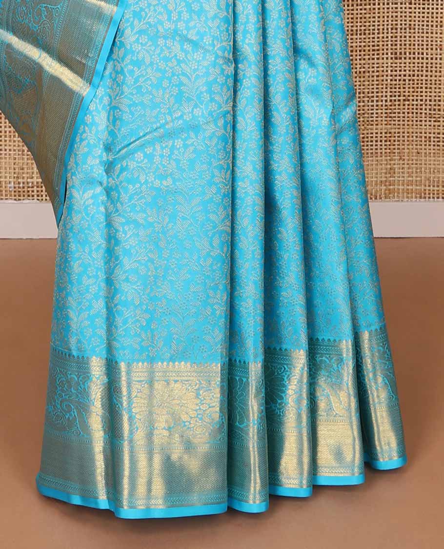 Blue floral jacqaurd silk saree with contrast design of thilakam mokku, banaras, manga design & floral pallu