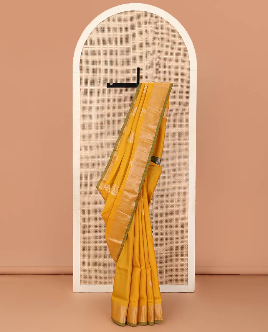 Yellow floral zari buttas Uppada saree, contrast bavanji border, and ogee patterned pallu