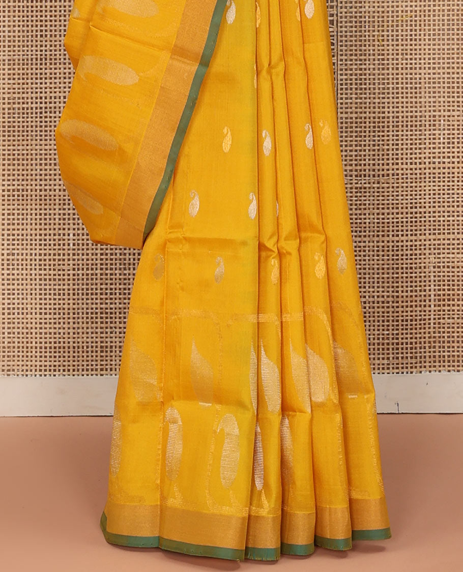 Yellow Uppada Silk Saree Gracefully Embellished with Zari Buttas and Paisley Buttas, Subtle Bavanji Border, Complemented by Contrast Pallu of Peacock Designs, and Paired with a Contrast Blouse