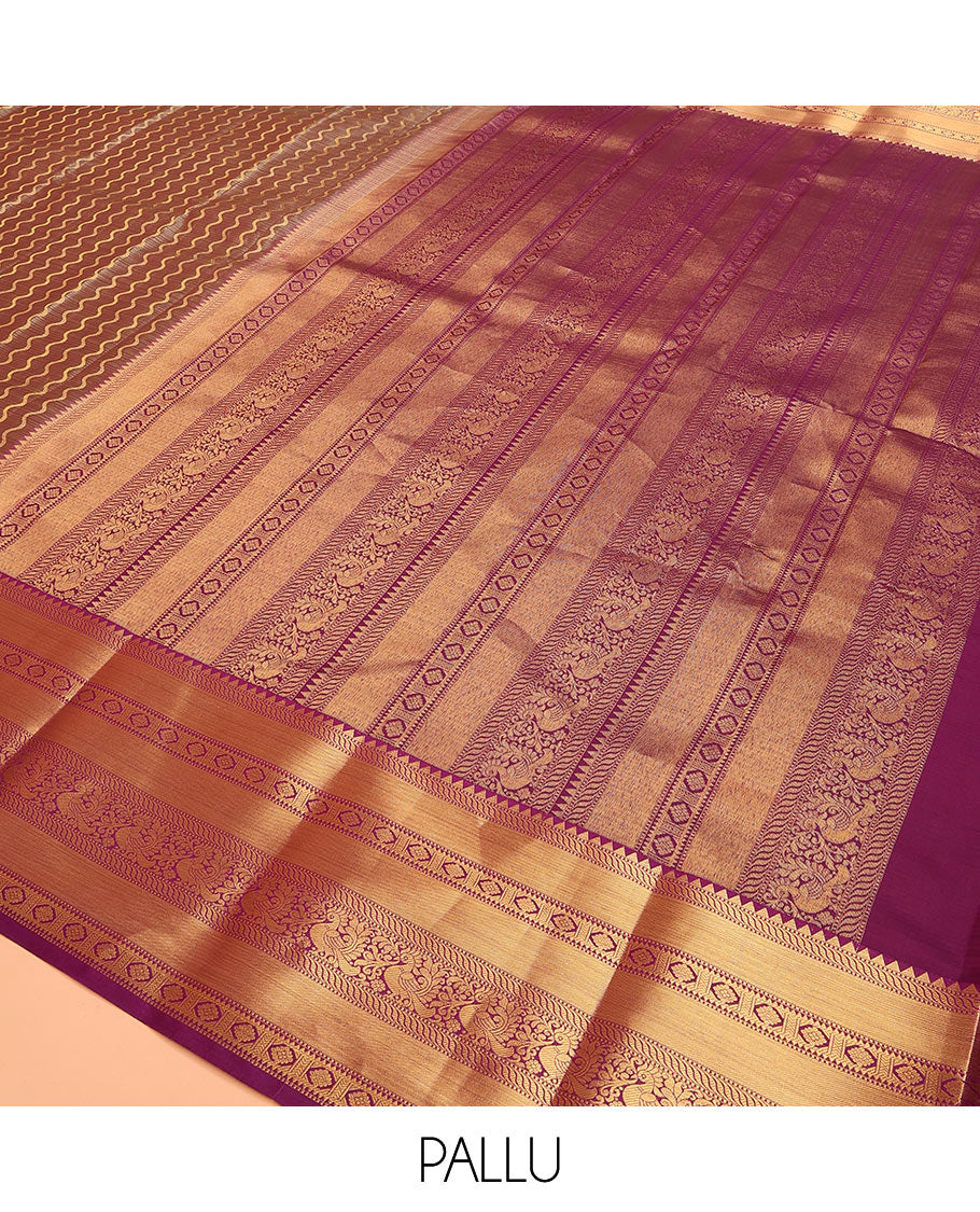 Brown Vasundhara Lite Silk Mix Saree Showcasing Zig-Zag Stripes Across the Body, Enhanced by a Contrast Border Adorned with Rekku, Puli Nagam, Laddu Kamalam, and Mayil Motifs, Complemented with a Zari-Woven Pallu and a Contrast Blouse
