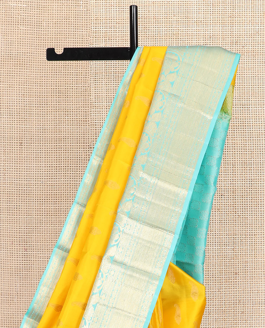 Yellow zari buttas silk saree, contrast border of thilakam, poun, kodi visiry, mayil kann, neli, and kathir designs, and butta enclosed checked pallu