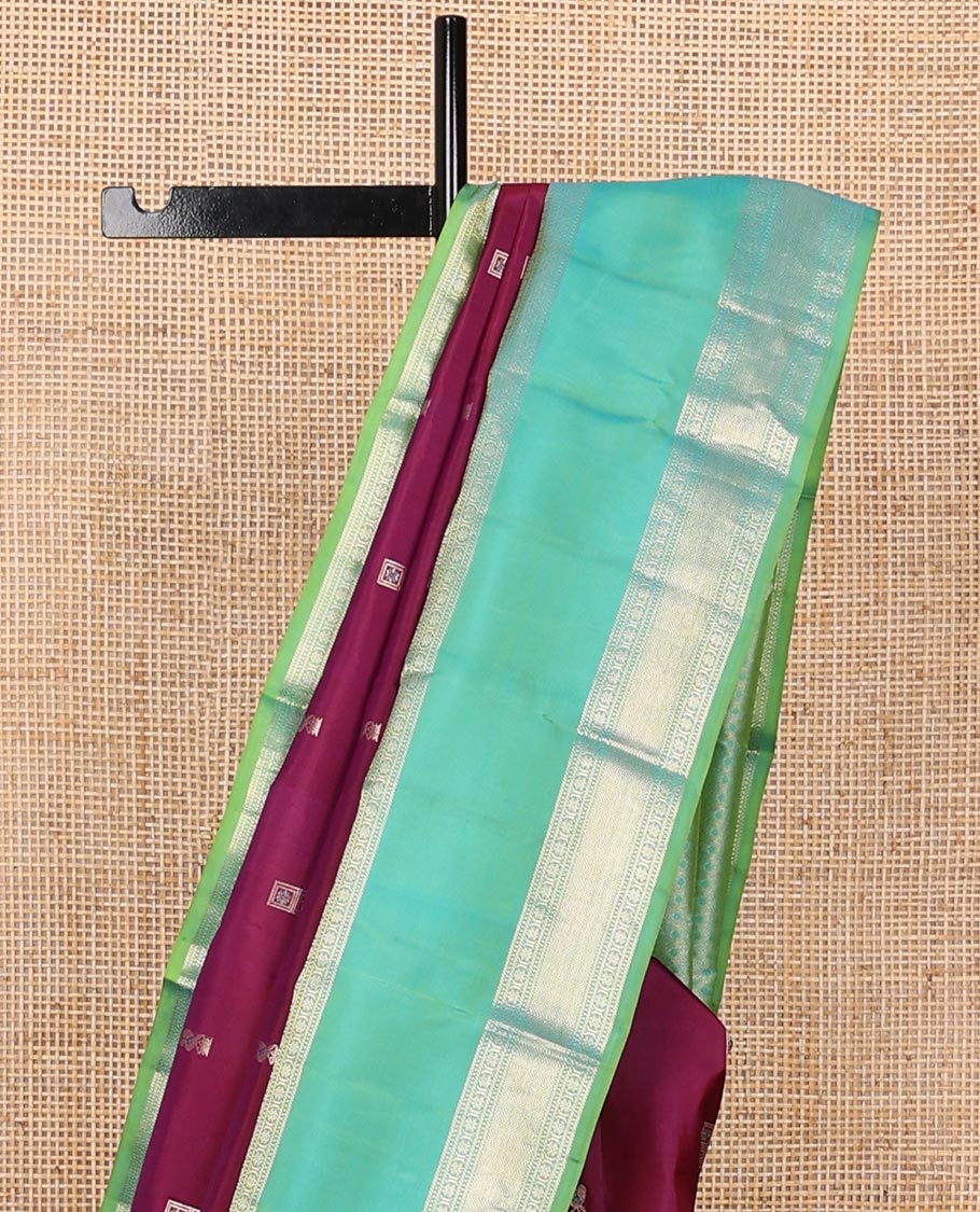 Purple meena buttas silksaree, contrast rettai pettu border of thilakam mokku,banaras,muthu & kodi visiry & zari-rich gleaming motifs pallu
