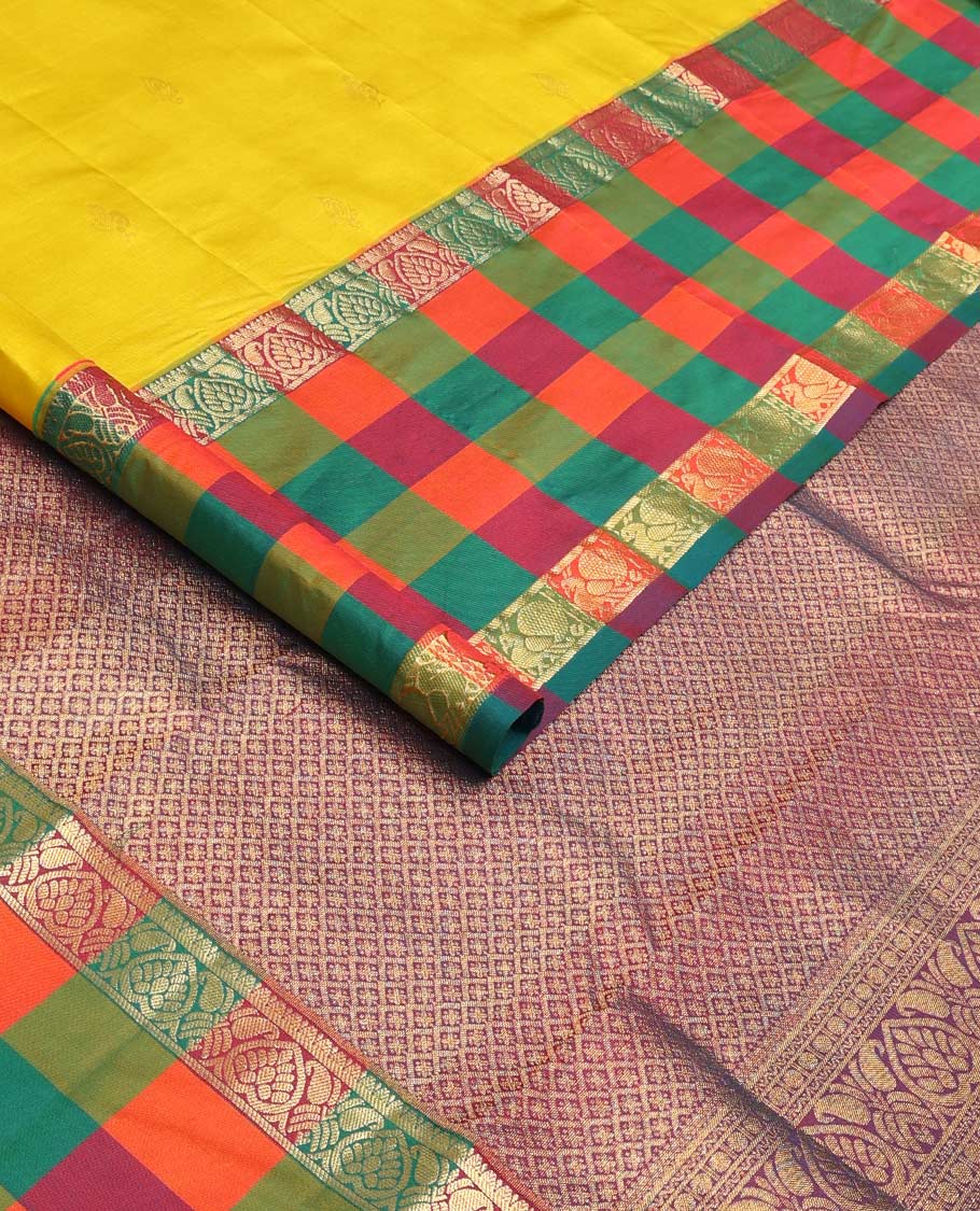Yellow zari buttas Kanchipuram silk saree, contrast multi-color checked border of jadai nagam, and mayil designs, and contrast zari-rich jaal pallu