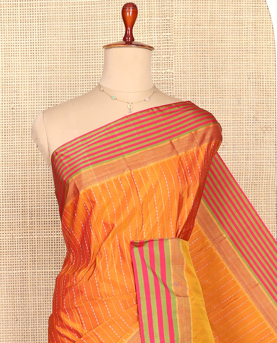 Orange Aarani Silk Saree, Enthralled with Zari Stripes All Over Its Body, Complemented by a Contrast Striped Border, Pallu of Stripes, and Paired with a Contrast Blouse