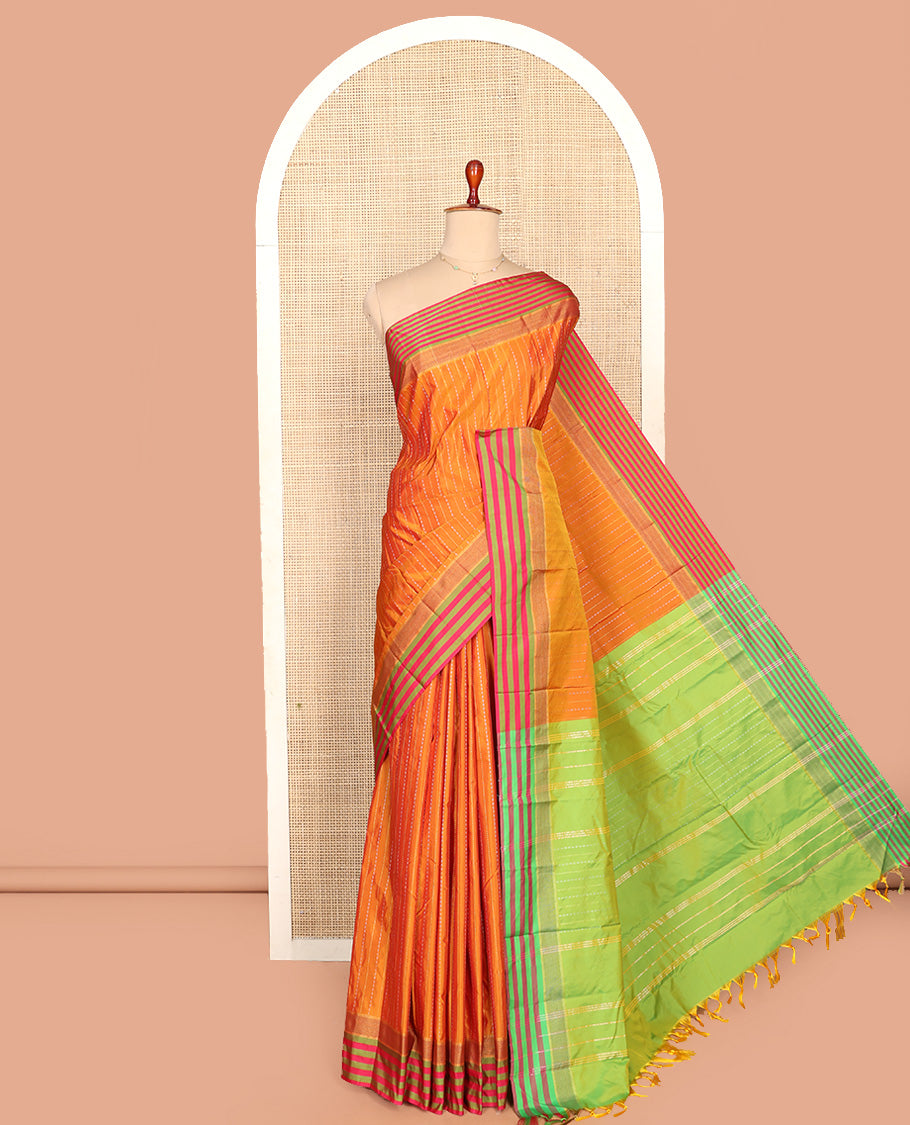 Orange Aarani Silk Saree, Enthralled with Zari Stripes All Over Its Body, Complemented by a Contrast Striped Border, Pallu of Stripes, and Paired with a Contrast Blouse