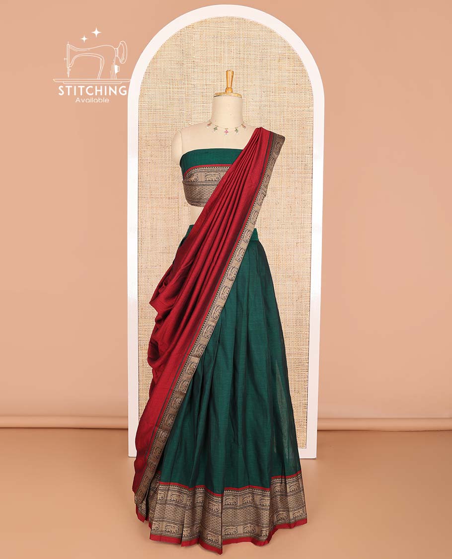 Bottle green cotton half saree with contrast intricate zari design border, zari design blouse & temple, elephant design dhavani