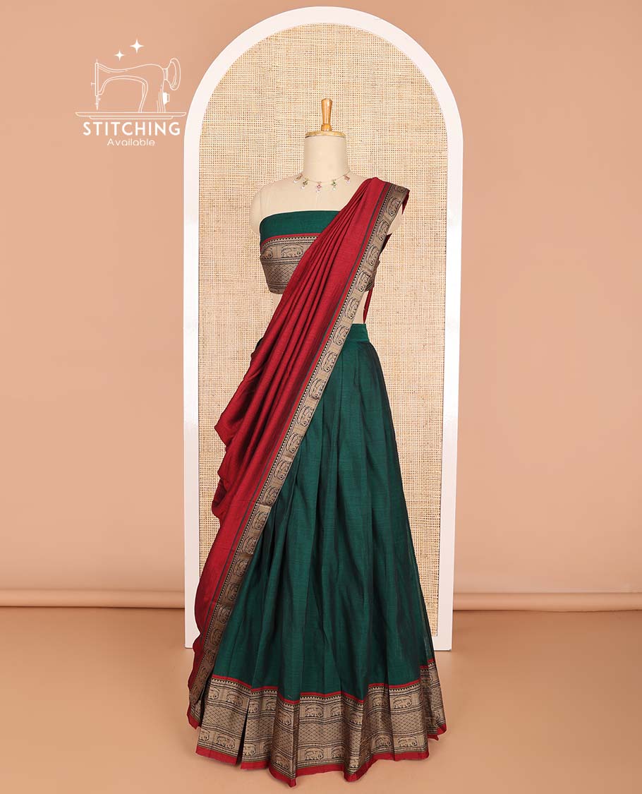 Bottle green cotton half saree with contrast intricate zari design border, zari design blouse & temple, elephant design dhavani