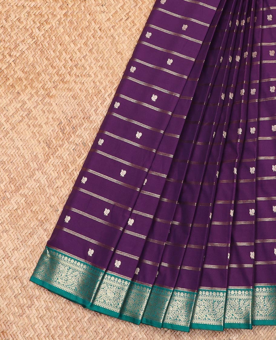 Violet Budget Silk Saree Detailed with Zari Stripes and Peacock Buttas, Complemented by a Contrast Border of Traditional Zari Designs, Subtly Jaal Design Pallu, and Paired with a Contrast Blouse