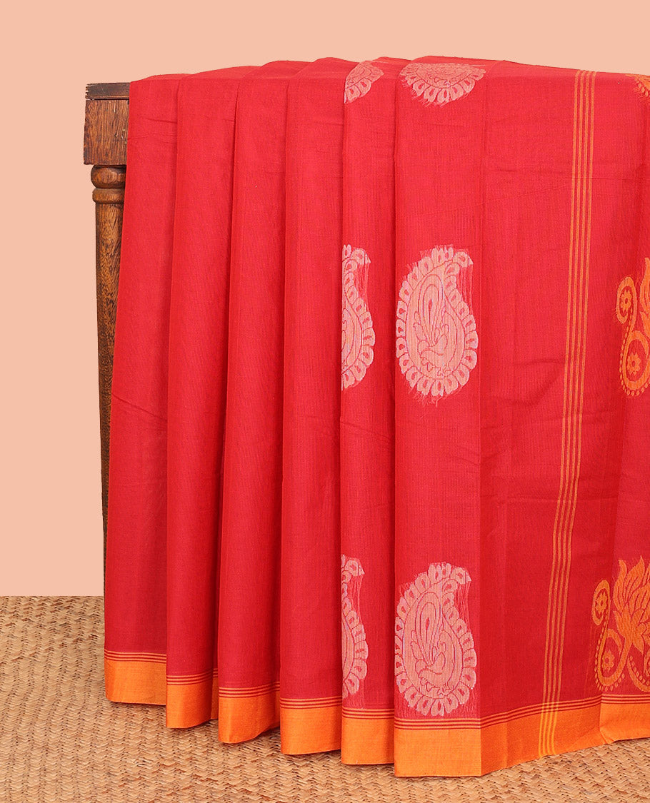 Red Kanchi Cotton Saree, Accentuated with Paisley Buttas All Over Its Body, Complemented by Contrast Border, Pallu Steeped with Floral Design, and Paired with a Matching Blouse