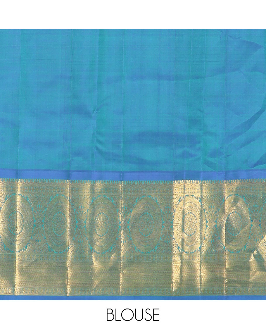 Green chakram buttas Kanchipuram silk saree, contrast border of muthu, rudraksham, poo chakram, and mayil kann designs, and chakram motifs pallu